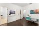 Bright bedroom featuring hardwood floors, study desk, double closet and ensuite bathroom at 9743 Chestnut Ridge Dr, Windermere, FL 34786