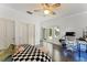 Bright bedroom with hardwood floors, modern lighting and sliding glass doors at 9743 Chestnut Ridge Dr, Windermere, FL 34786