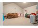 Large bonus room with beige carpet, lots of space, and an attic ceiling at 9743 Chestnut Ridge Dr, Windermere, FL 34786