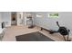 Carpeted home gym featuring workout equipment, natural light, and access to ensuite bathroom at 9743 Chestnut Ridge Dr, Windermere, FL 34786