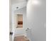 Hallway with stairs and window view into a room with a table and chairs at 9743 Chestnut Ridge Dr, Windermere, FL 34786