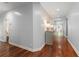 Hallway with hardwood floors, recessed lighting, decorative cabinet, and entryways to other rooms at 9743 Chestnut Ridge Dr, Windermere, FL 34786