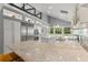 Bright kitchen with stainless steel appliances, an island, granite countertops, and a breakfast area with backyard views at 9743 Chestnut Ridge Dr, Windermere, FL 34786