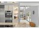Kitchen with stainless steel appliances and granite countertops, and an open view to the rest of the home at 9743 Chestnut Ridge Dr, Windermere, FL 34786