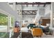 Open-concept living area with high ceilings, bar, and access to outdoor pool space at 9743 Chestnut Ridge Dr, Windermere, FL 34786
