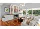Inviting living room features built-in shelving and cabinets, cozy fireplace, and ample natural light at 9743 Chestnut Ridge Dr, Windermere, FL 34786