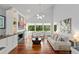 Open living room features modern lighting, large windows, and comfortable seating for relaxation and entertainment at 9743 Chestnut Ridge Dr, Windermere, FL 34786