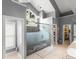 Spacious main bathroom featuring a large glass shower, granite countertop with and sinks, and modern fixtures at 9743 Chestnut Ridge Dr, Windermere, FL 34786