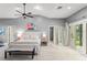 This spacious primary bedroom has a serene atmosphere with bright natural light and views of the yard at 9743 Chestnut Ridge Dr, Windermere, FL 34786