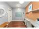 Bright office featuring modern lighting, built in storage and hardwood floors at 9743 Chestnut Ridge Dr, Windermere, FL 34786