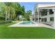 Inviting pool area featuring lounge seating, lush green grass, and a serene outdoor space at 9743 Chestnut Ridge Dr, Windermere, FL 34786