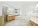 Spacious bathroom featuring a walk-in shower, soaking tub, and double vanity at 10080 Cove Lake Dr, Orlando, FL 32836