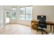 Bright bedroom with a work desk and view of the pool from the window at 10080 Cove Lake Dr, Orlando, FL 32836