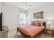 Bright bedroom with a ceiling fan and decorative artwork at 10080 Cove Lake Dr, Orlando, FL 32836