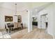 Bright dining area featuring hardwood floors, chandelier, and natural light at 10080 Cove Lake Dr, Orlando, FL 32836