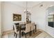 Traditional dining room featuring hardwood floors, chandelier, and breakfast nook view at 10080 Cove Lake Dr, Orlando, FL 32836