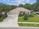 Well-maintained single-story home boasting a three-car garage and mature landscaping at 10080 Cove Lake Dr, Orlando, FL 32836