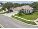 Well-manicured lawn and garden beds accentuates the home's curb appeal at 10080 Cove Lake Dr, Orlando, FL 32836