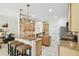 Spacious kitchen includes counter seating, stainless steel appliances, island, and convenient access to the living room at 10080 Cove Lake Dr, Orlando, FL 32836