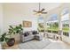 Bright living room with large windows, vaulted ceilings, and hardwood floors at 10080 Cove Lake Dr, Orlando, FL 32836