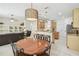 Open floor plan showcasing kitchen, dining area, and living room, creating a seamless and inviting space at 10080 Cove Lake Dr, Orlando, FL 32836