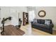 Bright office area with a bookshelf, sofa, and large monitor at 10080 Cove Lake Dr, Orlando, FL 32836