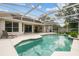 Beautiful screened pool area with an attached patio, perfect for relaxing and entertaining at 10080 Cove Lake Dr, Orlando, FL 32836