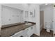 Bright bathroom features a large mirror, granite countertop, and tile flooring at 101 Grand Plaza Dr # A40, Orange City, FL 32763