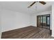 Cozy bedroom featuring a ceiling fan, and sliding glass doors that let in lots of natural light at 101 Grand Plaza Dr # A40, Orange City, FL 32763
