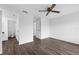 Open bedroom features a ceiling fan, an ensuite bathroom, and new hard wood floors at 101 Grand Plaza Dr # A40, Orange City, FL 32763