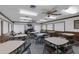 Spacious clubhouse with ceiling fans, tables, and chairs at 101 Grand Plaza Dr # A40, Orange City, FL 32763