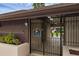 Gated community entrance with security camera and signage at 101 Grand Plaza Dr # A40, Orange City, FL 32763