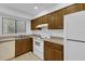 Efficient kitchen with appliances and tile flooring, offering a practical cooking space at 101 Grand Plaza Dr # A40, Orange City, FL 32763