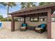 Covered poolside seating area at 101 Grand Plaza Dr # A40, Orange City, FL 32763