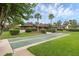Shuffleboard courts and neatly manicured landscaping enhance the exterior appeal at 101 Grand Plaza Dr # A40, Orange City, FL 32763