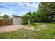 Backyard with brick accents, a decorative statue, and lush greenery at 1021 N Forest Ave, Orlando, FL 32803