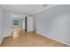 Clean bedroom features wood floors, neutral walls, and a large mirrored closet at 1021 N Forest Ave, Orlando, FL 32803