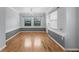 Living room with hardwood floors, natural light, and a modern chandelier at 1021 N Forest Ave, Orlando, FL 32803