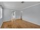 Bright and airy living room featuring hardwood floors and a seamless flow to other areas at 1021 N Forest Ave, Orlando, FL 32803