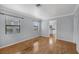 Inviting living room with hardwood floors and plenty of natural light, perfect for relaxing at 1021 N Forest Ave, Orlando, FL 32803