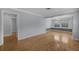 Open concept living space with hardwood floors, neutral colors, and natural light at 1021 N Forest Ave, Orlando, FL 32803