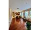 Hardwood flooring throughout open dining space featuring natural light and views into the kitchen area at 10350 Lake District Ln # S, Orlando, FL 32832