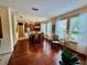 Open dining area with hardwood floors and ample natural light, perfect for Gathering gatherings at 10350 Lake District Ln # S, Orlando, FL 32832