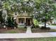 Charming two-story home with a front porch, balcony and lush landscaping creating a welcoming curb appeal at 10350 Lake District Ln # S, Orlando, FL 32832