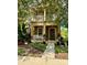 Inviting two-story home featuring a cozy front porch, upper balcony, and beautifully landscaped front yard at 10350 Lake District Ln # S, Orlando, FL 32832