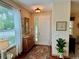 Welcoming foyer featuring hardwood floors, decorative mirror, and ample natural light at 10350 Lake District Ln # S, Orlando, FL 32832