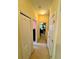 Bright hallway with neutral walls and carpet, leading to various rooms within the home at 10350 Lake District Ln # S, Orlando, FL 32832