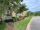 Charming home exterior with manicured landscaping, vibrant foliage, and a well-maintained lawn at 10350 Lake District Ln # S, Orlando, FL 32832