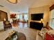 Open-concept living room flows into the dining area, ideal for entertaining at 10350 Lake District Ln # S, Orlando, FL 32832