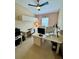 Bright office with modern white desk, ceiling fan, and ample space for productivity at 10350 Lake District Ln # S, Orlando, FL 32832